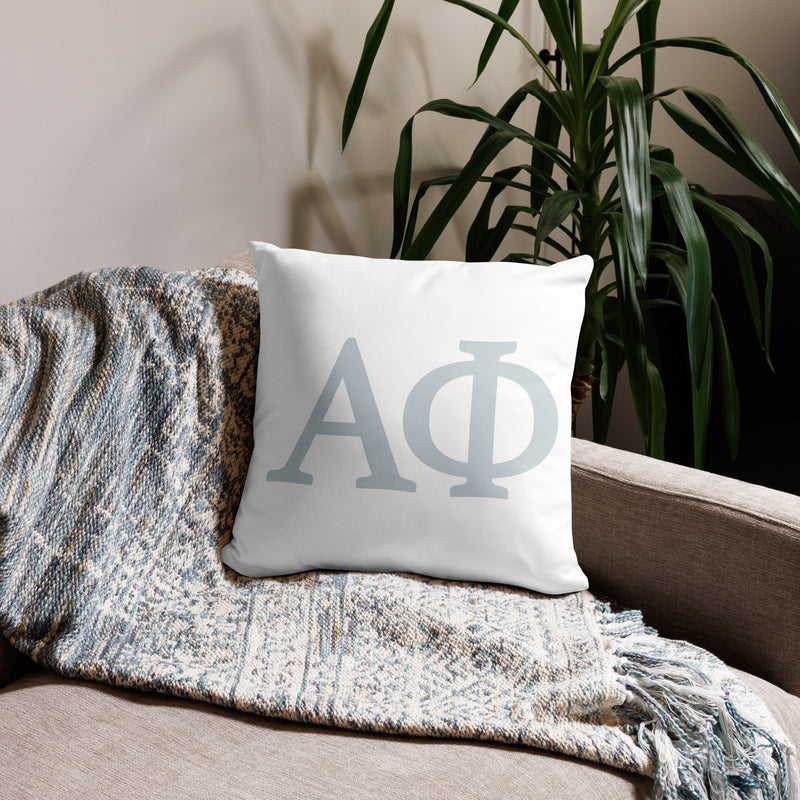 alpha phi silver letters reversible pillow shown on couch