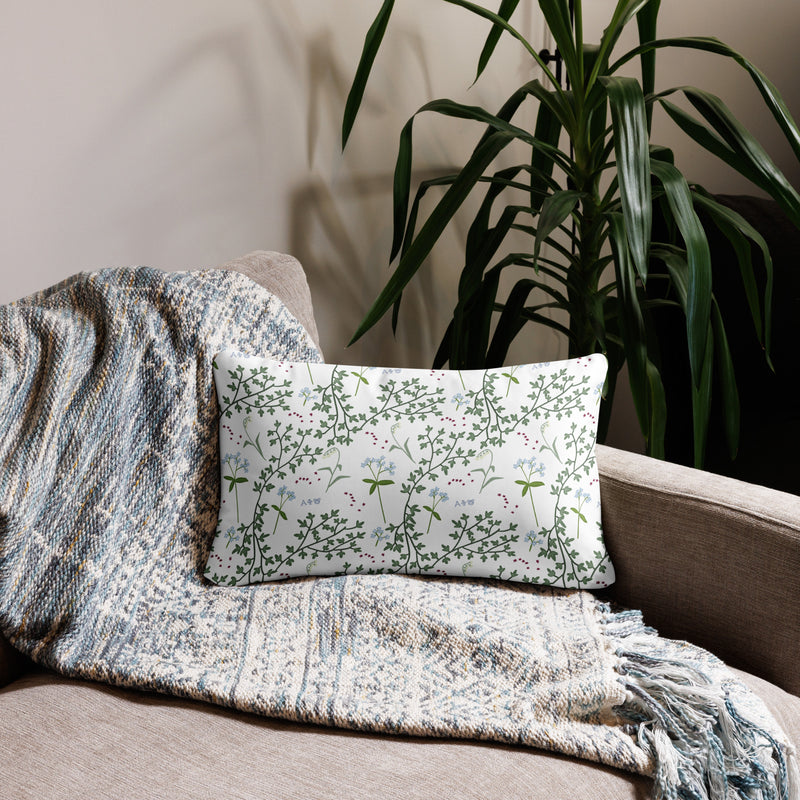 Alpha Phi Silver Letters Sorority Pillow in 20" x 12" lumbar size showing floral print on back on couch