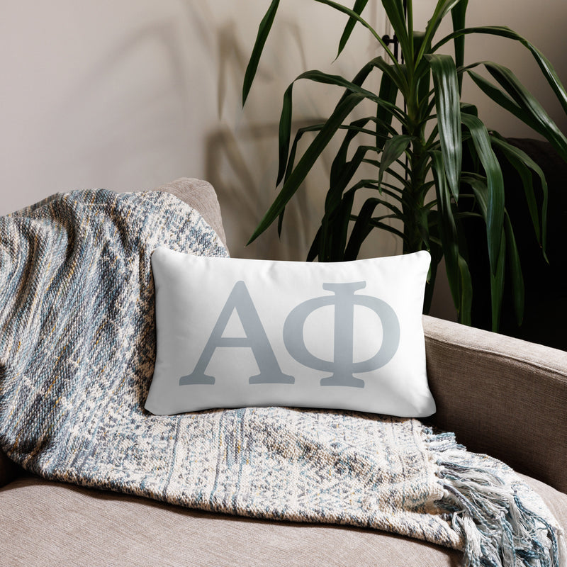 Alpha Phi Silver Letters Sorority Pillow in 20" x 12" lumbar size showing front on couch
