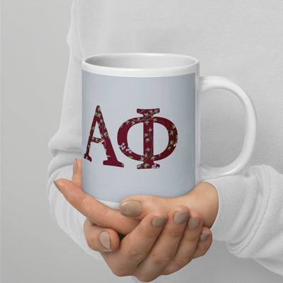 Alpha Phi Greek letters mug in Silver  with floral print filled letters in 20 oz size