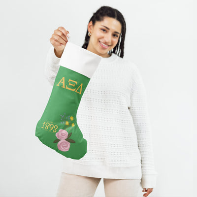 Alpha Xi 1893 Green Holiday Stocking in model's hands
