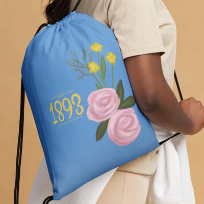 Alpha Xi Delta Drawstring Bag shown on model's shoulder with 1893 founding year design