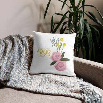 Alpha Xi Delta 1893 Sorority Pillow in white 18 x 18 size shown on couch