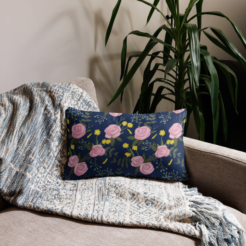 Alpha Xi Delta Sorority Pillow showing floral print on reverse side in Navy Blue in 20" x 12" size on couch