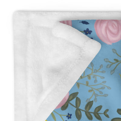 Alpha Xi Delta Sorority Blanket with rose floral print showing solid white reverse side