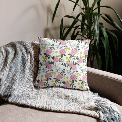 Alpha Xi Delta Realize Motto Pillow in white floral print in 18 x 18 size shown on couch