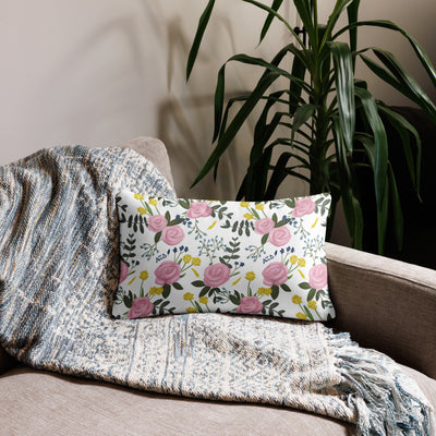 Alpha Xi Delta Realize Motto Pillow in white floral print in 20 x 12 size shown on couch