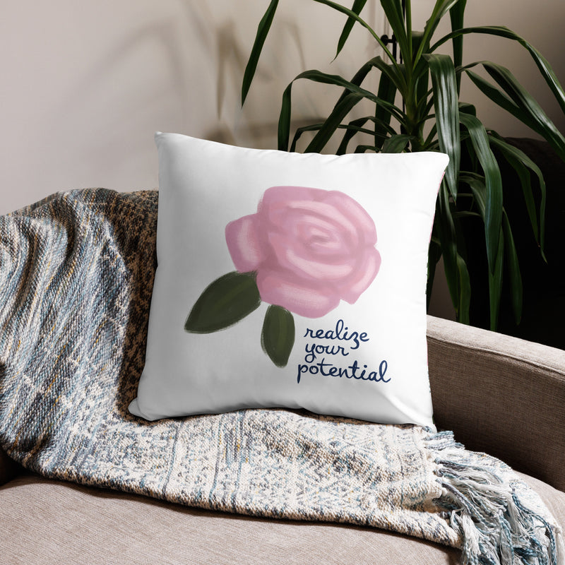 Alpha Xi Delta Realize Motto Pillow in white in 22 x 22 size shown on couch