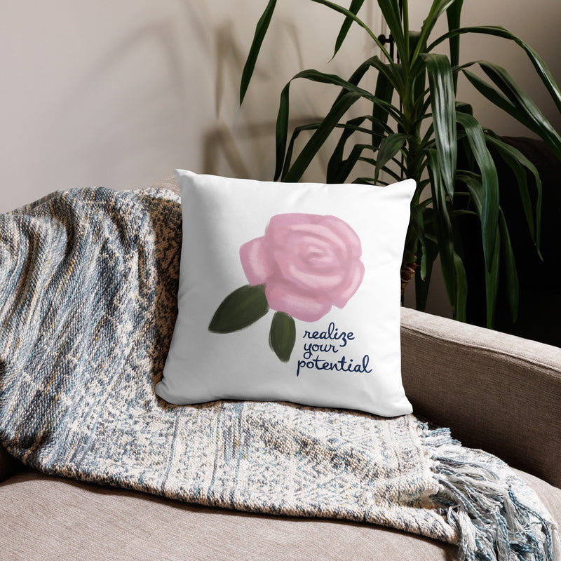 Alpha Xi Delta Realize Motto Pillow in white in 18 x 18 size shown on couch