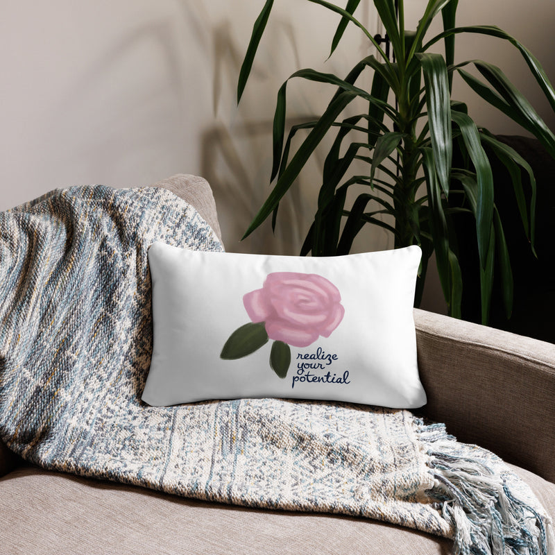 Alpha Xi Delta Realize Motto Pillow in white in 20 x 12 size shown on couch