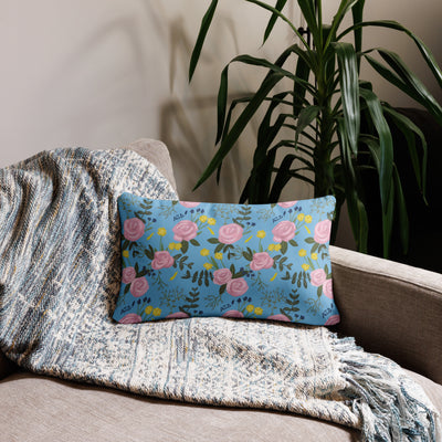 Alpha Xi Delta 1893 Sorority Pillow in 20 x 12 size showing floral print in light blue on back shown on couch
