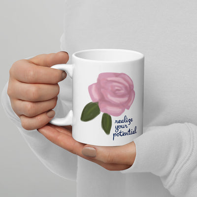 Alpha Xi Delta Mom 11 oz Mug showing motto on reverse side in model's hands