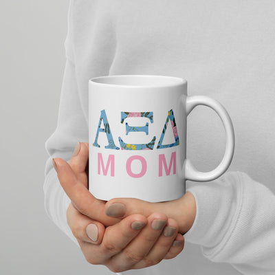 Alpha Xi Delta Mom Mug in 11 oz Mug shown in model's hands.