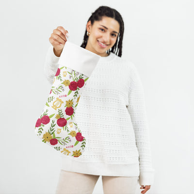 Alpha Chi Floral Print Holiday Stocking in model's hands