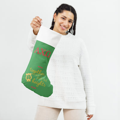 Alpha Chi Heights Holiday Stocking in model's hand