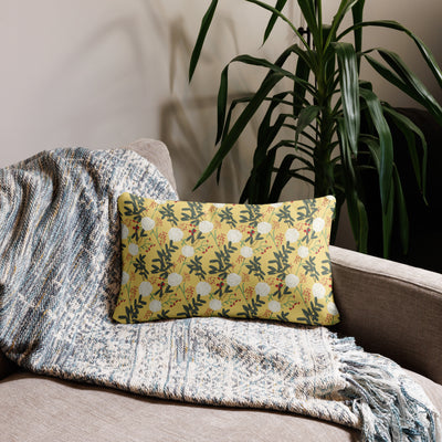 Chi Omega Owl Mascot Pillow showing reverse carnation floral print shown on chair