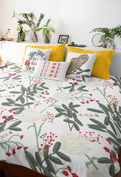 Chi Omega Floral Duvet Cover in fresh white shown in mockup with pillows