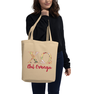 Chi Omega Sorority Tote Bag in natural oyster color with scarlet red lettering in model's hands