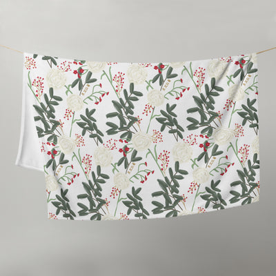 Chi Omega Sorority Throw Blanket shown on clothesline with white carnation floral print