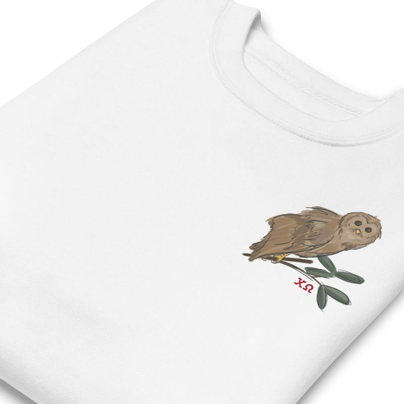 Chi Omega Owl Crewneck Sweatshirt in white in folded view