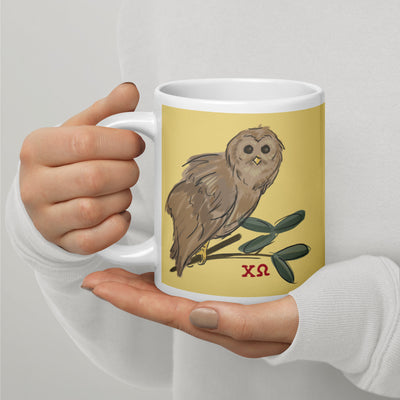 Chi Omega Owl Mug in 20 oz size shown in model's hands