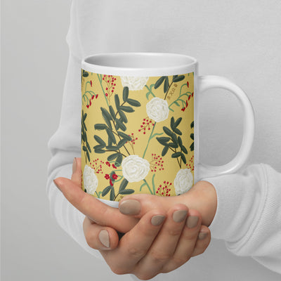 Chi Omega Sorority Mug in 20 oz size in model's hands with carnation floral print in straw