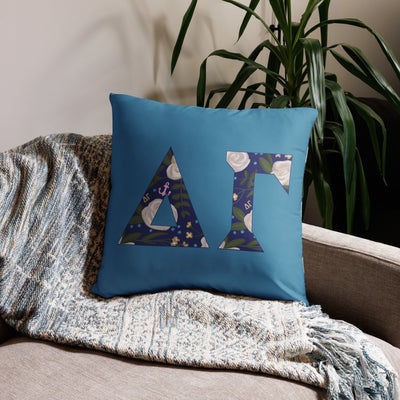 Delta Gamma Sorority Letters Pillow in 22" x 22" size in Legacy Blue on couch