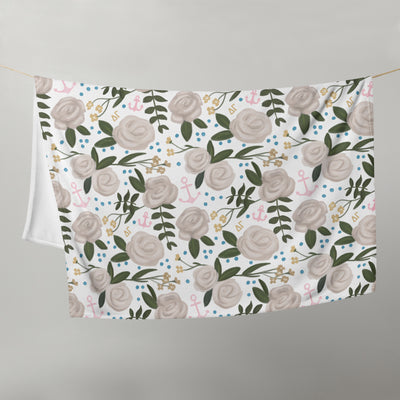 Delta Gamma Sorority Blanket with white floral print shown hanging on a clothesline