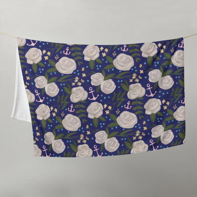 Delta Gamma Sorority Blanket in navy blue floral print shown hanging on clothesline