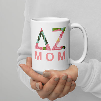 Delta Zeta Sorority Mom Mug in 15 oz size shown in model's hands with DZ letters