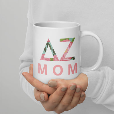 Delta Zeta Sorority Mom Mug in 20 oz size shown in model's hands with DZ letters