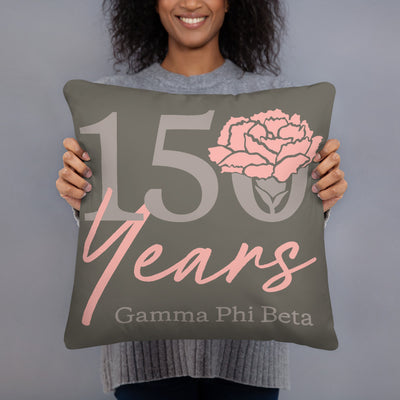 G Phi 150th Anniversary Brownstone Pillow in model's hands