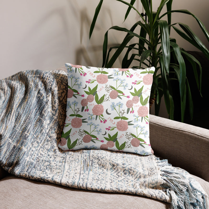 Gamma Phi Beta Sorority Pillow showing floral print on back in white of 22" x 22" pillow shown on couch