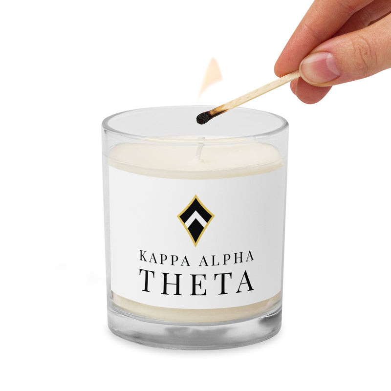 Theta Logo Glass Jar Soy Candle being lit