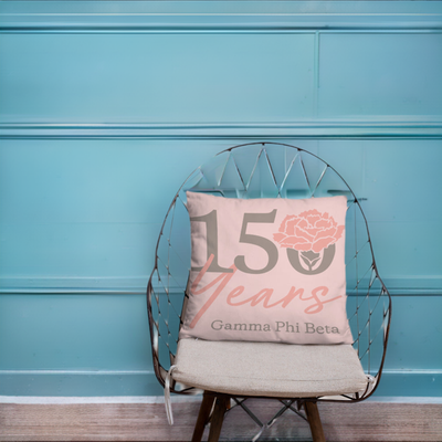 G Phi 150th Anniversary Reversible Pillow on chair