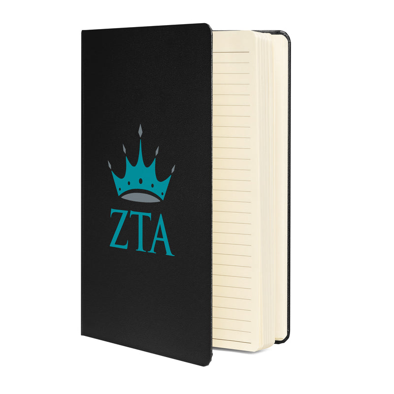 Crown + ZTA Hardcover Journal in black showing lined pages inside