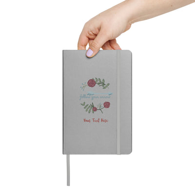 Pi Phi Follow Your Arrow Hardcover Journal in silver in woman's hand