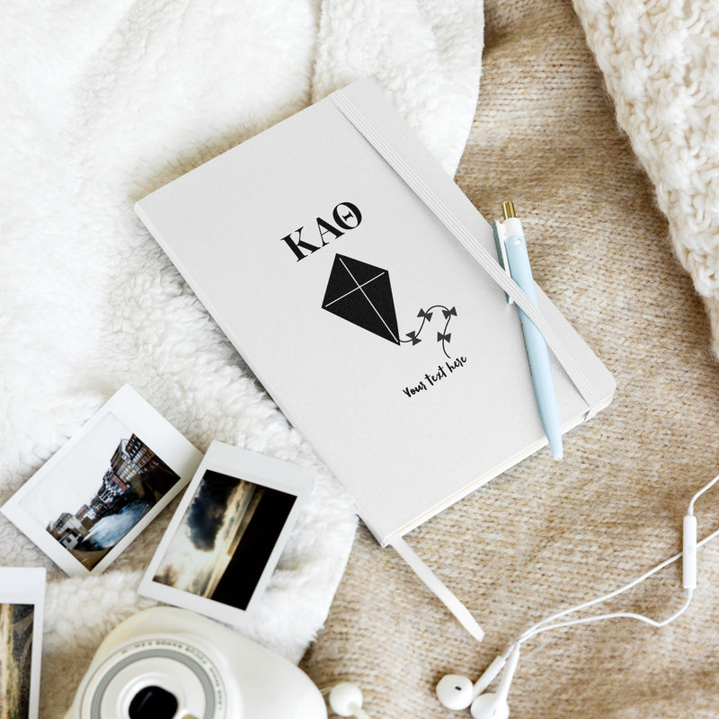 Theta Kite Personalized Hardcover Journal in white in lifestyle setting