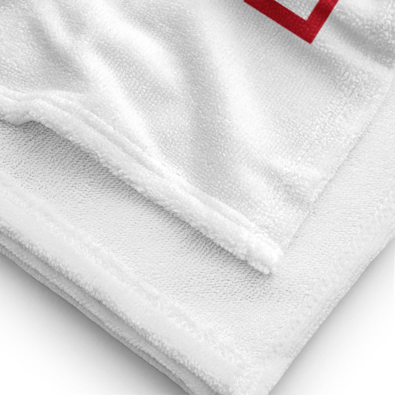 Junior League Beach and Bath Towel in white showing solid white reverse side