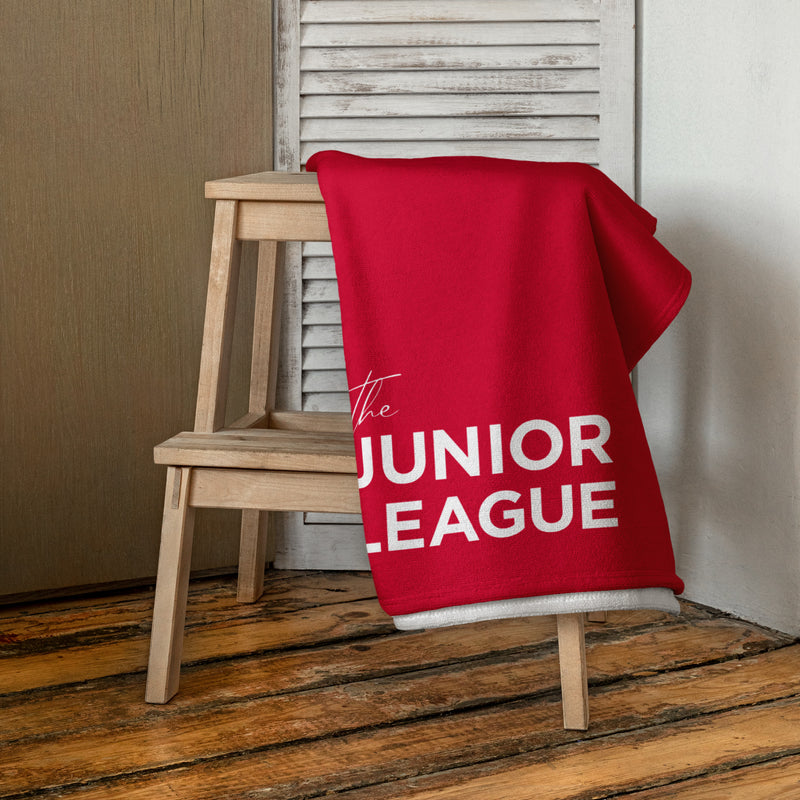 Junior League Red and White Beach Towel shown in a bathroom scene