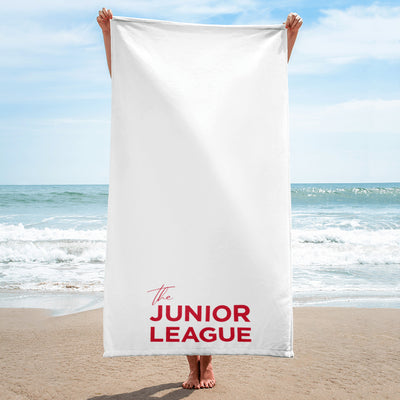 Junior League Beach and Bath Towel in white shown in beach scene