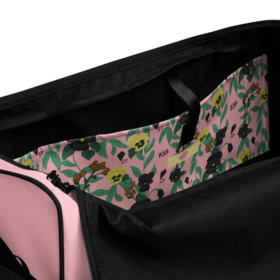 Kappa Alpha Theta Pink Duffel Bag showing interior pocket with pansy floral print