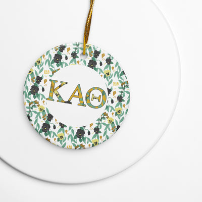 Kappa Alpha Theta Holiday ornament made from ceramic featuring filled Theta letters and pansy floral accent