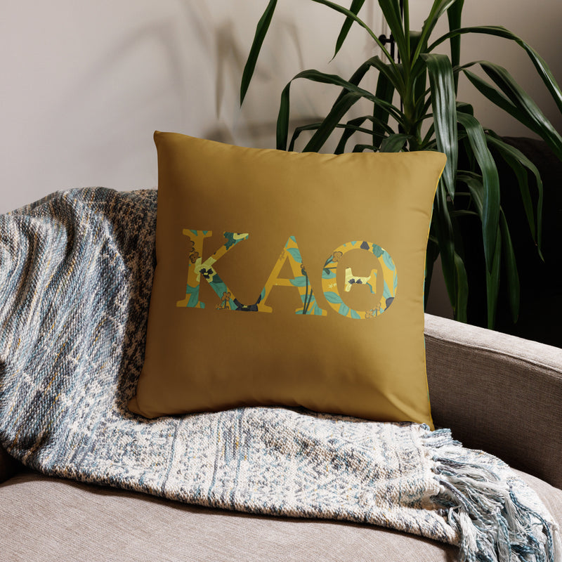 Kappa Alpha theta letters pillow shown in 22" x 22" size on couch