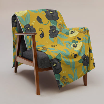 Kappa Alpha Theta Pansy Floral Print Sorority Blanket shown on chair