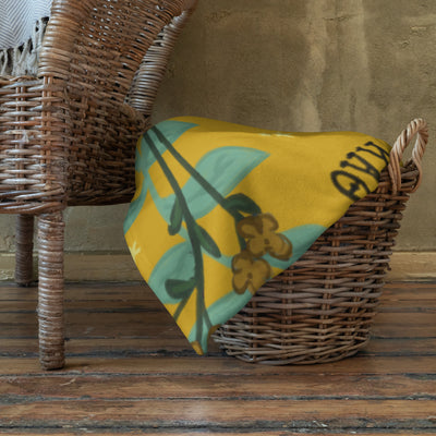 Kappa Alpha Theta Pansy Floral Print Sorority Blanket shown in basket
