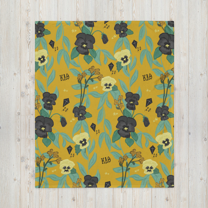 Kappa Alpha Theta Pansy Floral Print Sorority Blanket shown flat in gold