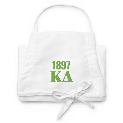Kappa Delta 1897 Embroidered Apron shown in detail view with green embroidery