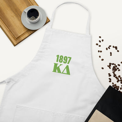 Kappa Delta 1897 Embroidered Apron shown in white in lifestyle setting