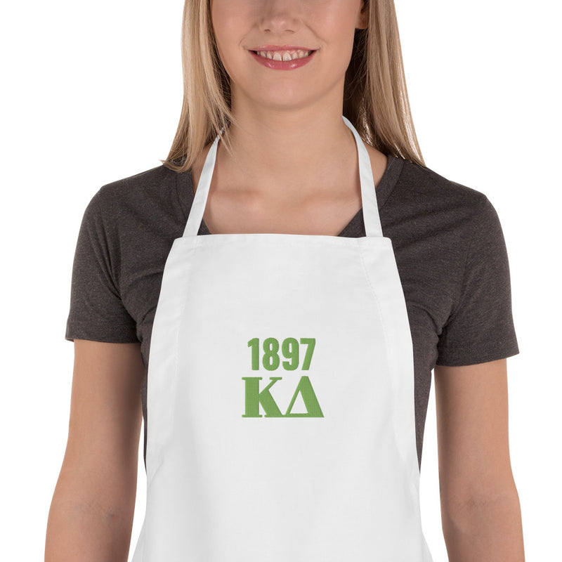 Kappa Delta 1897 Embroidered Apron shown in detail view with green embroidery